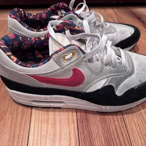 Nike Air Max White and Black Sneakers with Red Swoosh